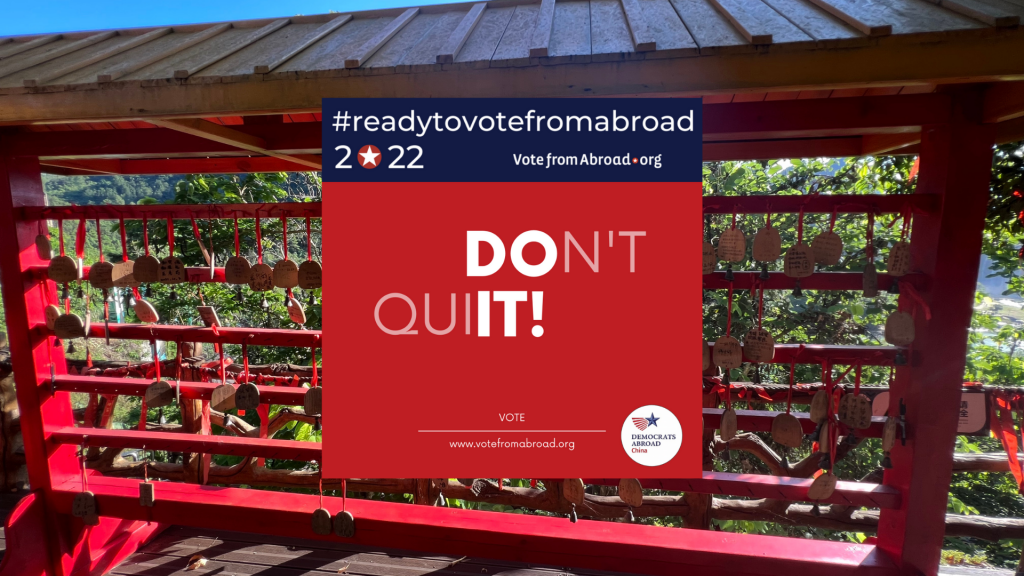 Photo taken from Datian Falls, which overlook Vietnam. Red wish and luck display is shown. Graphic in the front reads "#ReadyToVoteFromAbroad. 2022. VoteFromAbroad.org. Don't Quit! Vote." Democrats Abroad China logo. 